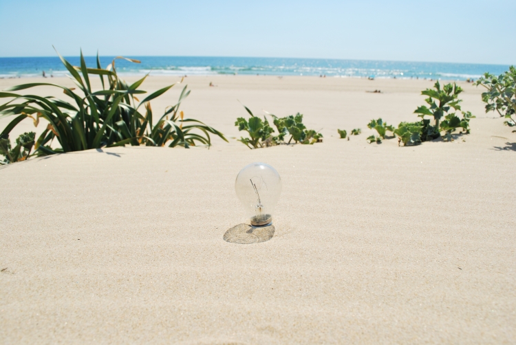 Lightbulb on sand (global warming)